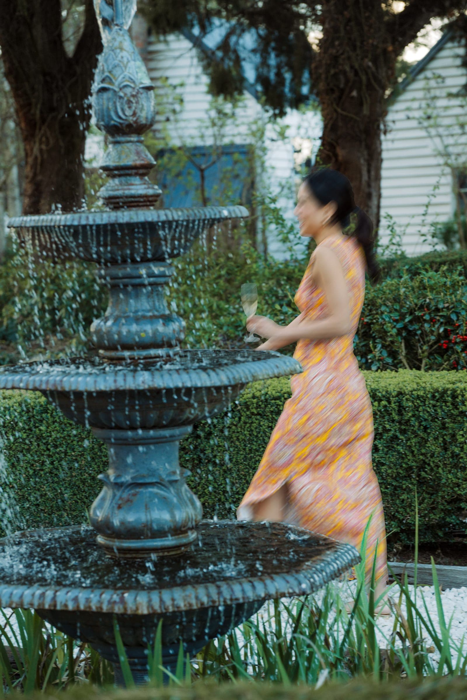 A guest walking beside the fountain