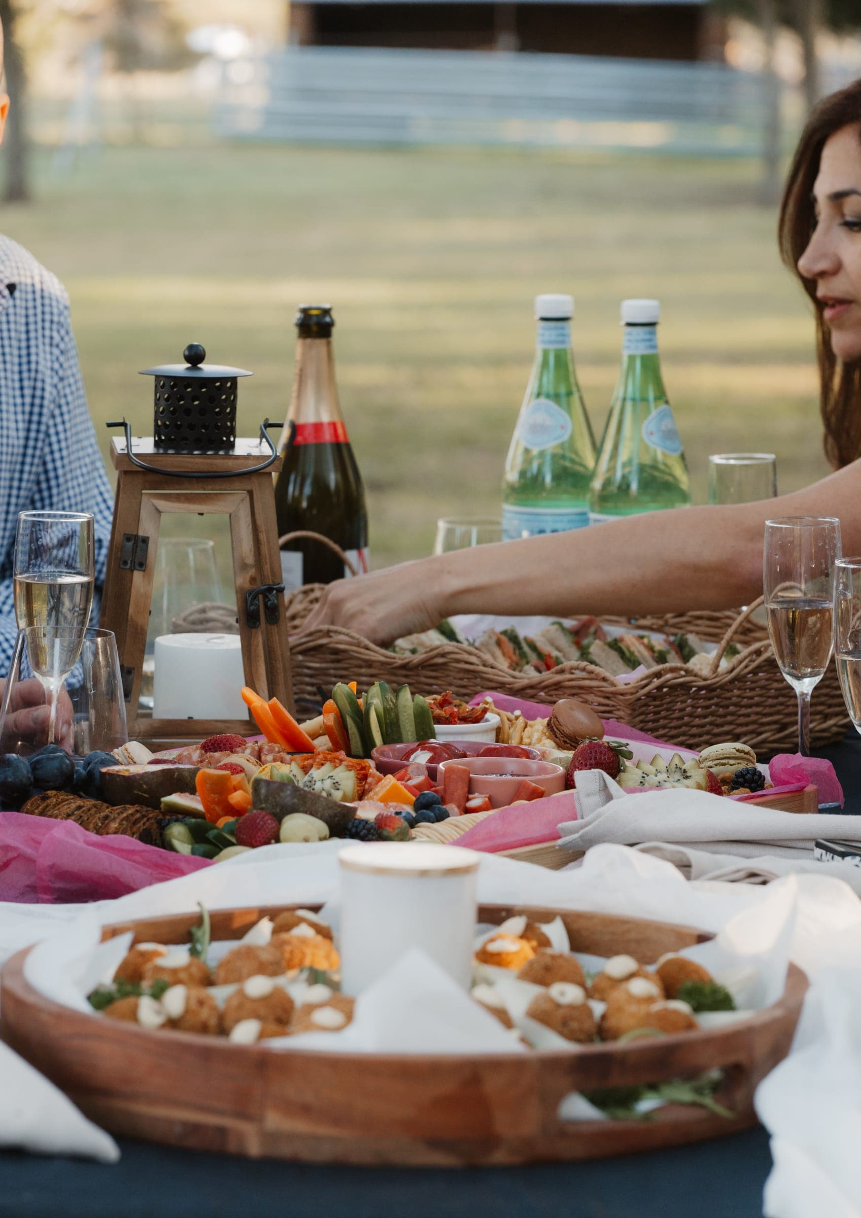 A grazing table with champagne set for a garden celebration