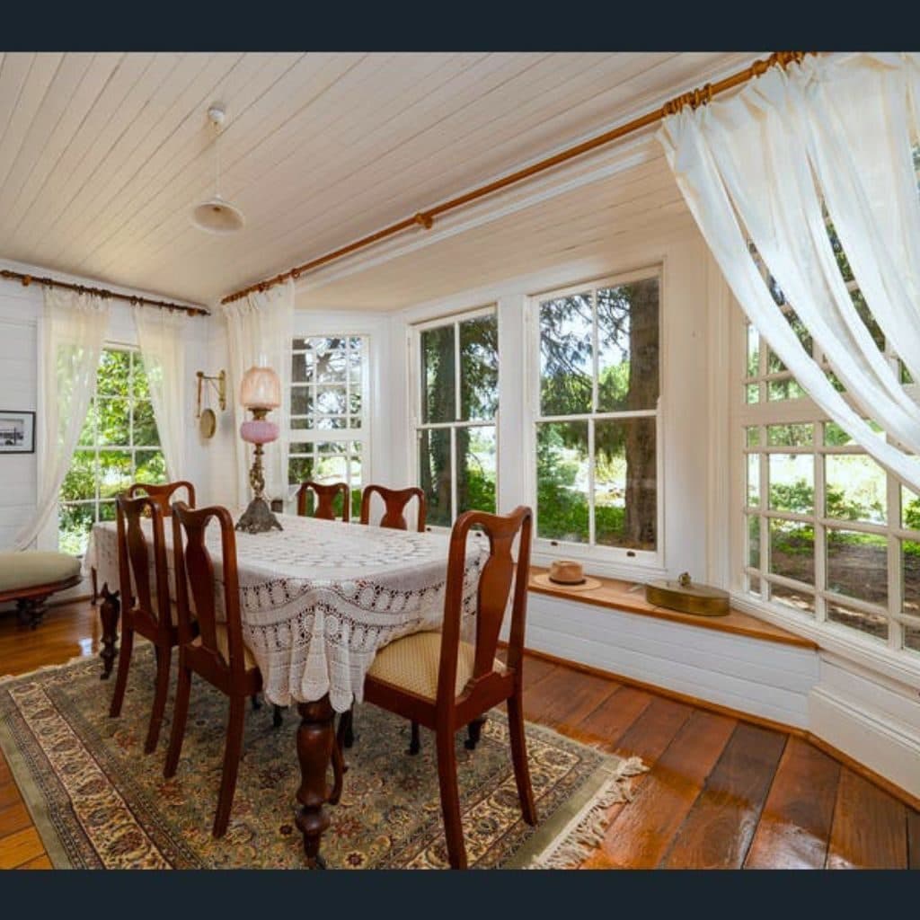 The restored farmhouse dining room with garden views