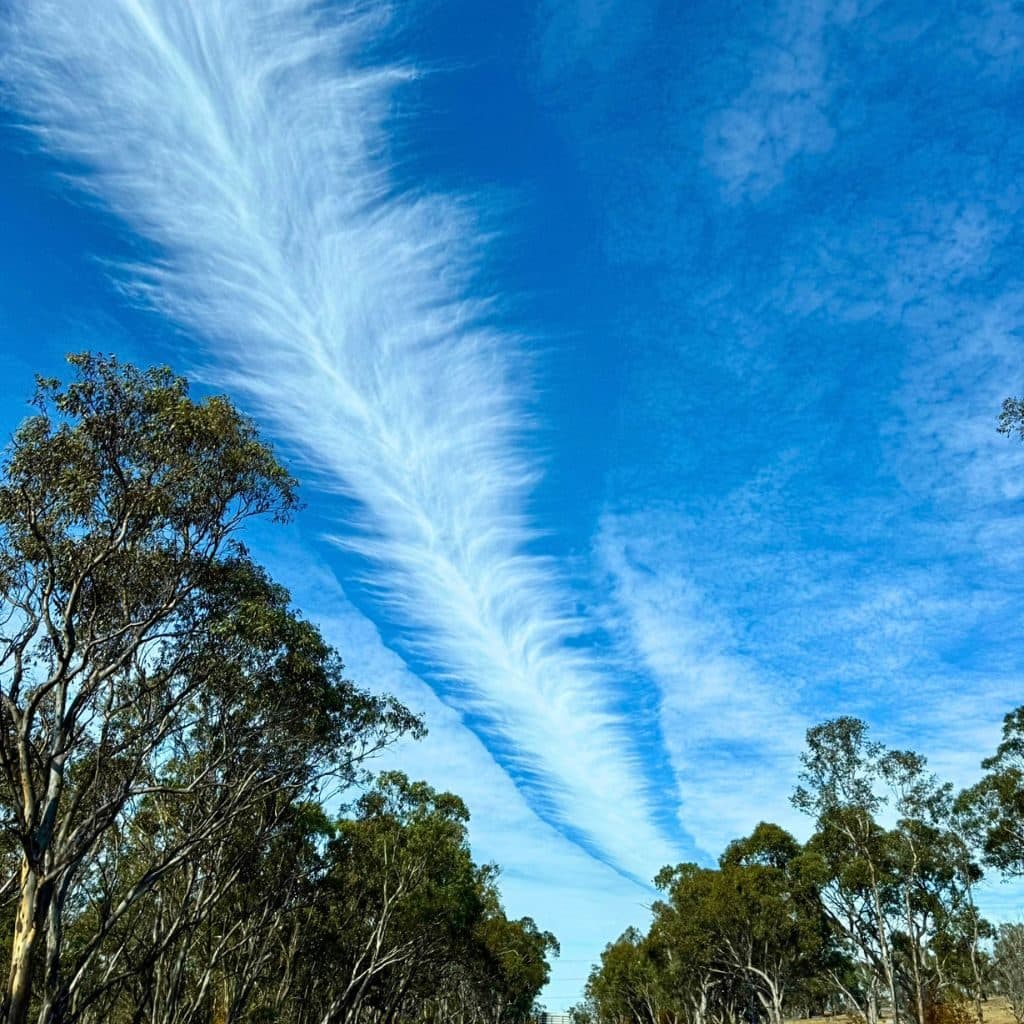 A wide blue New England sky over the highway near Guyra