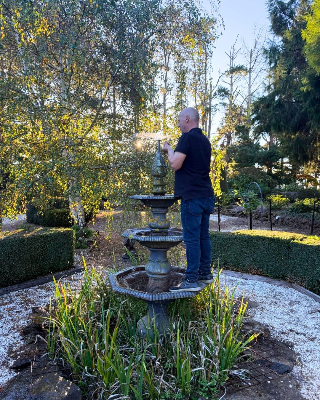 Jaime restoring the tiered fountain in the formal garden